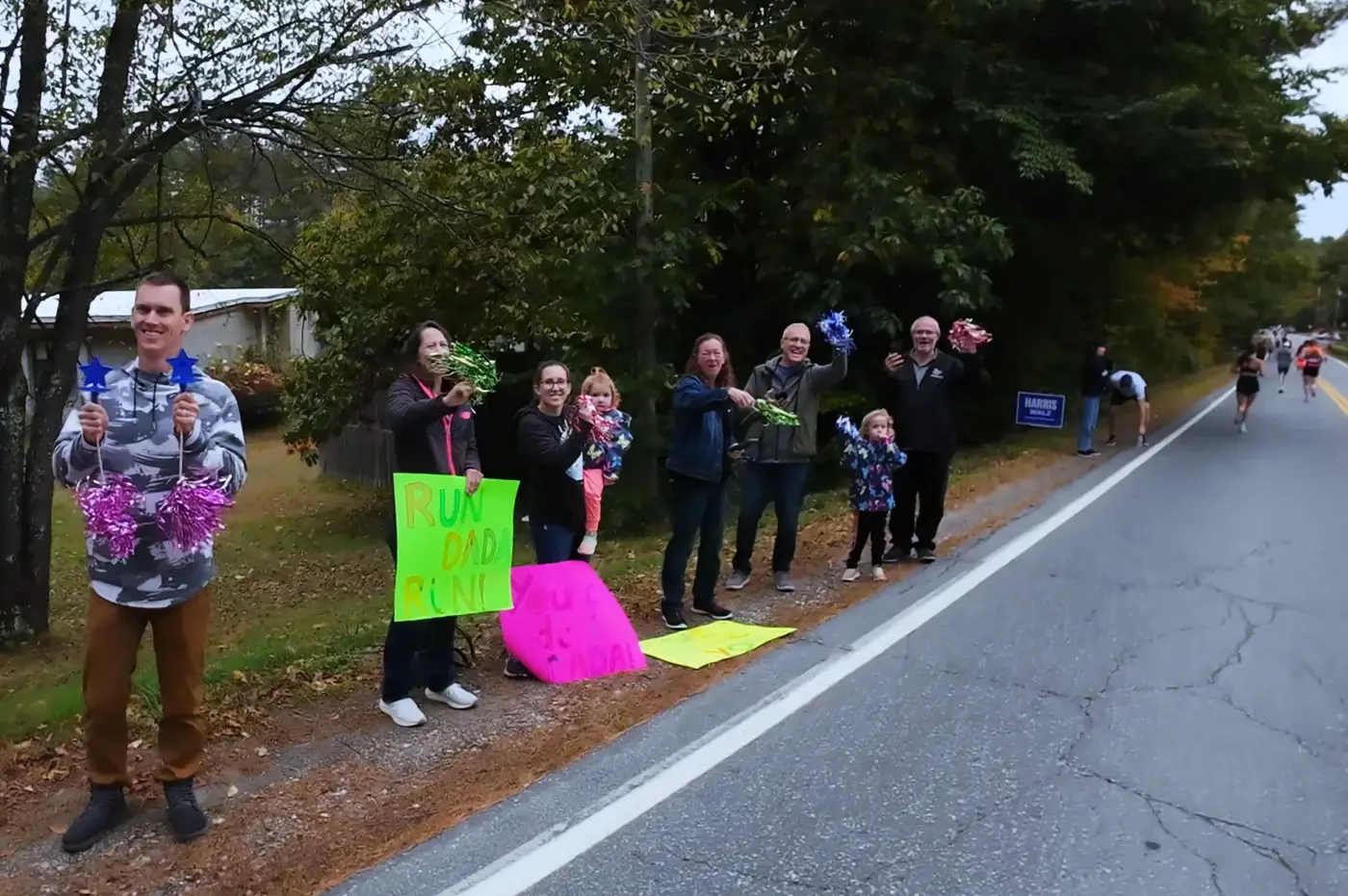 Local spectators ringing bells on the