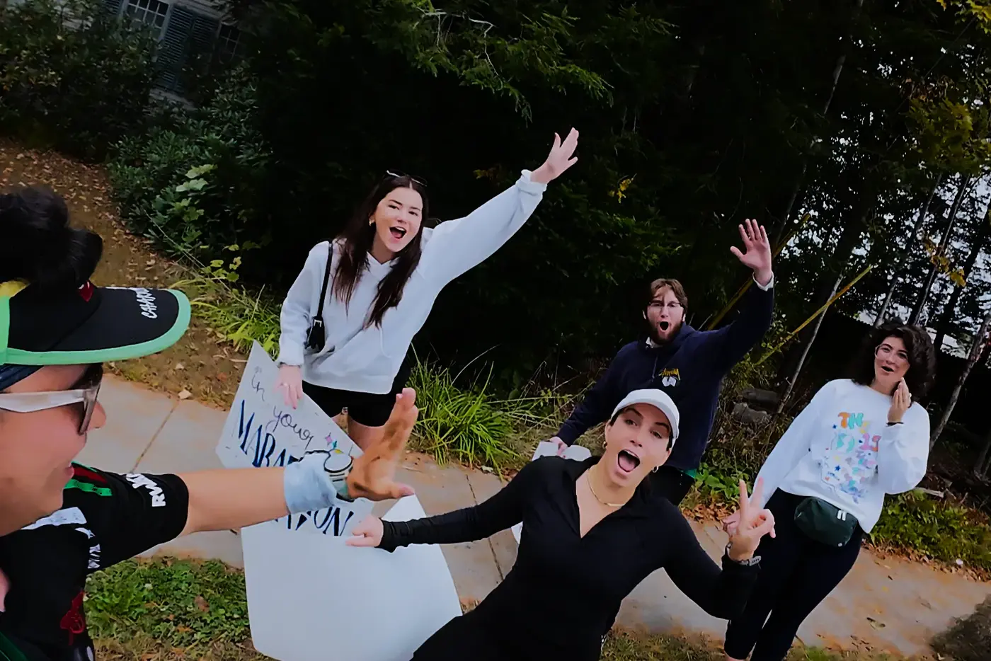 Cheer squad in white along the forested