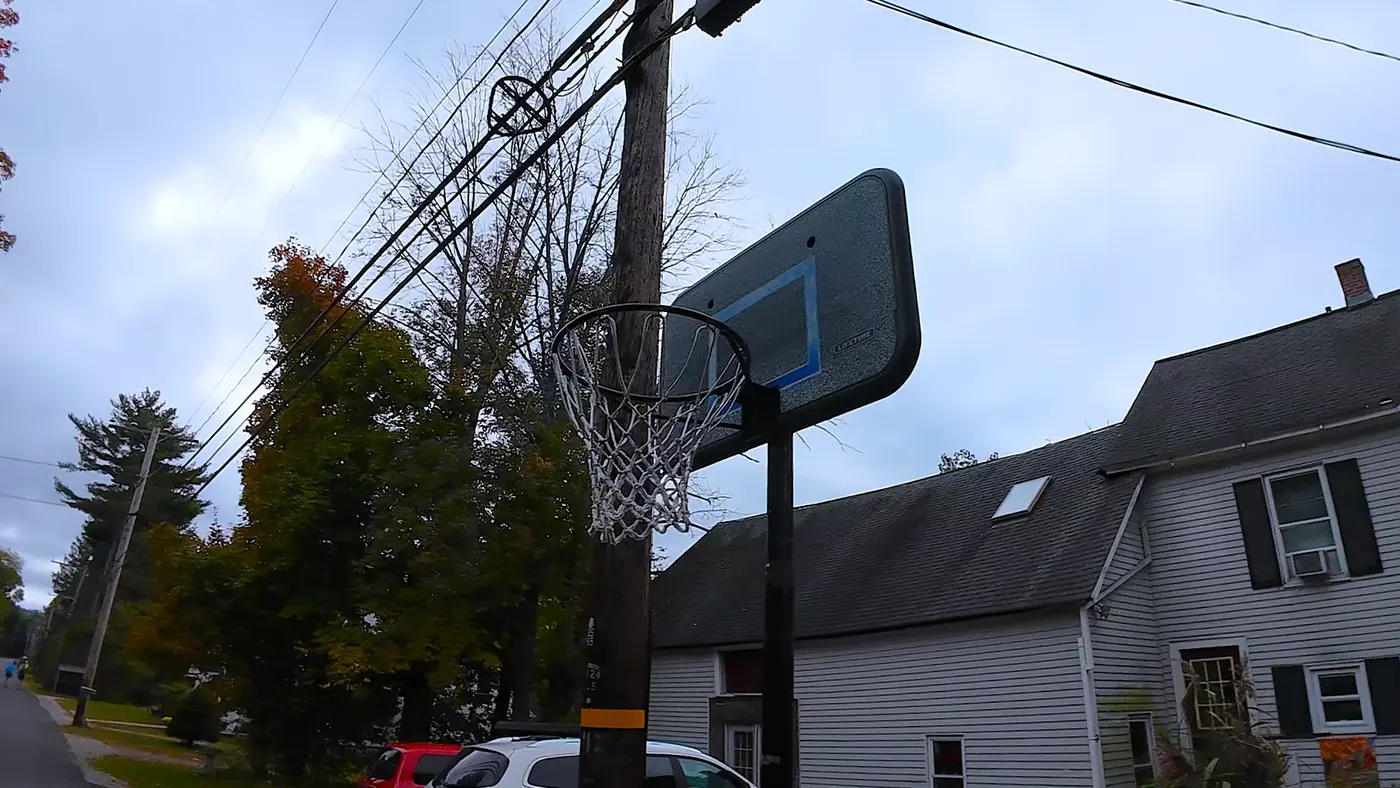 Basketball hoop and neighborhood houses