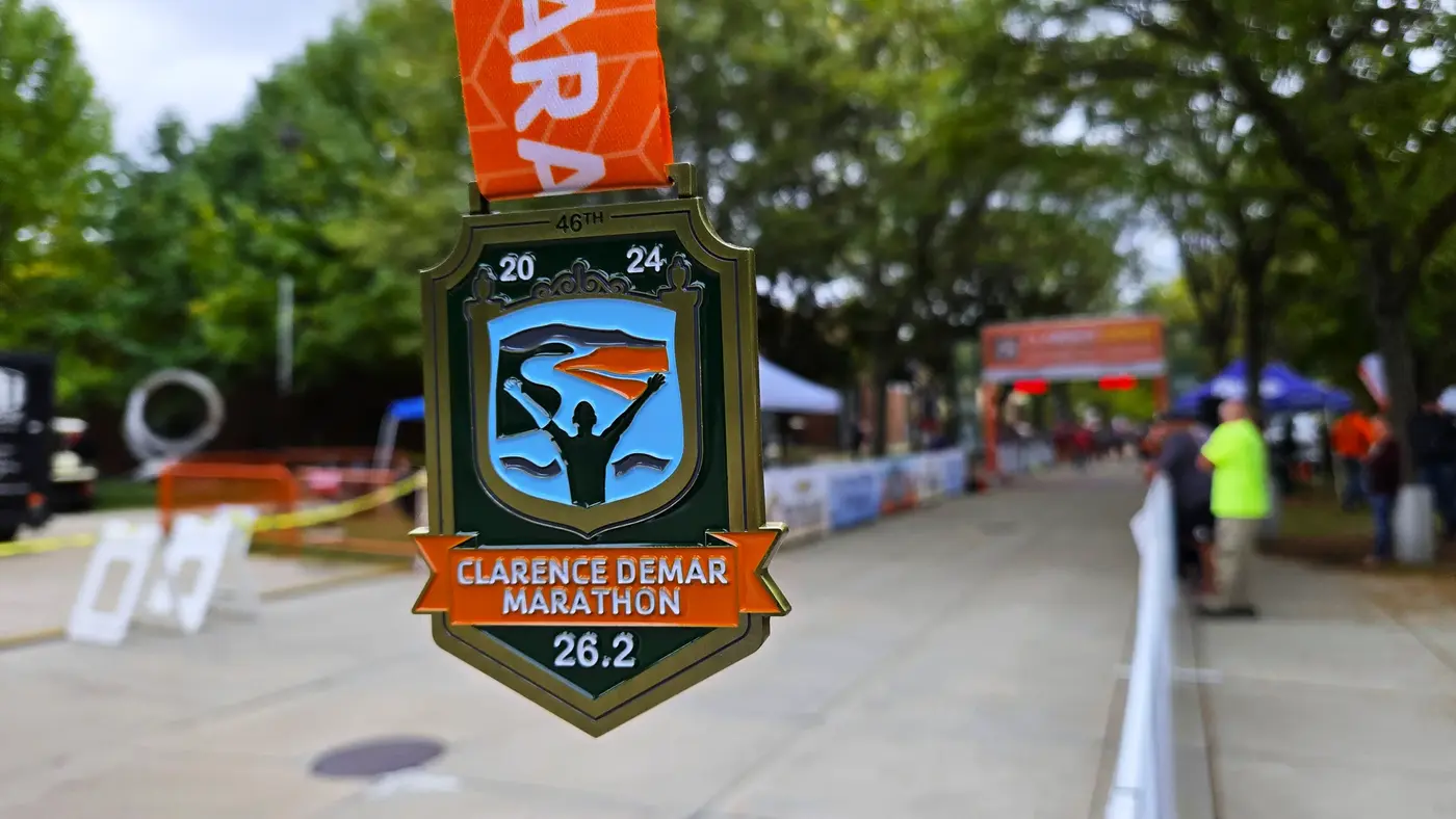 Clarence DeMar finisher medal close-up