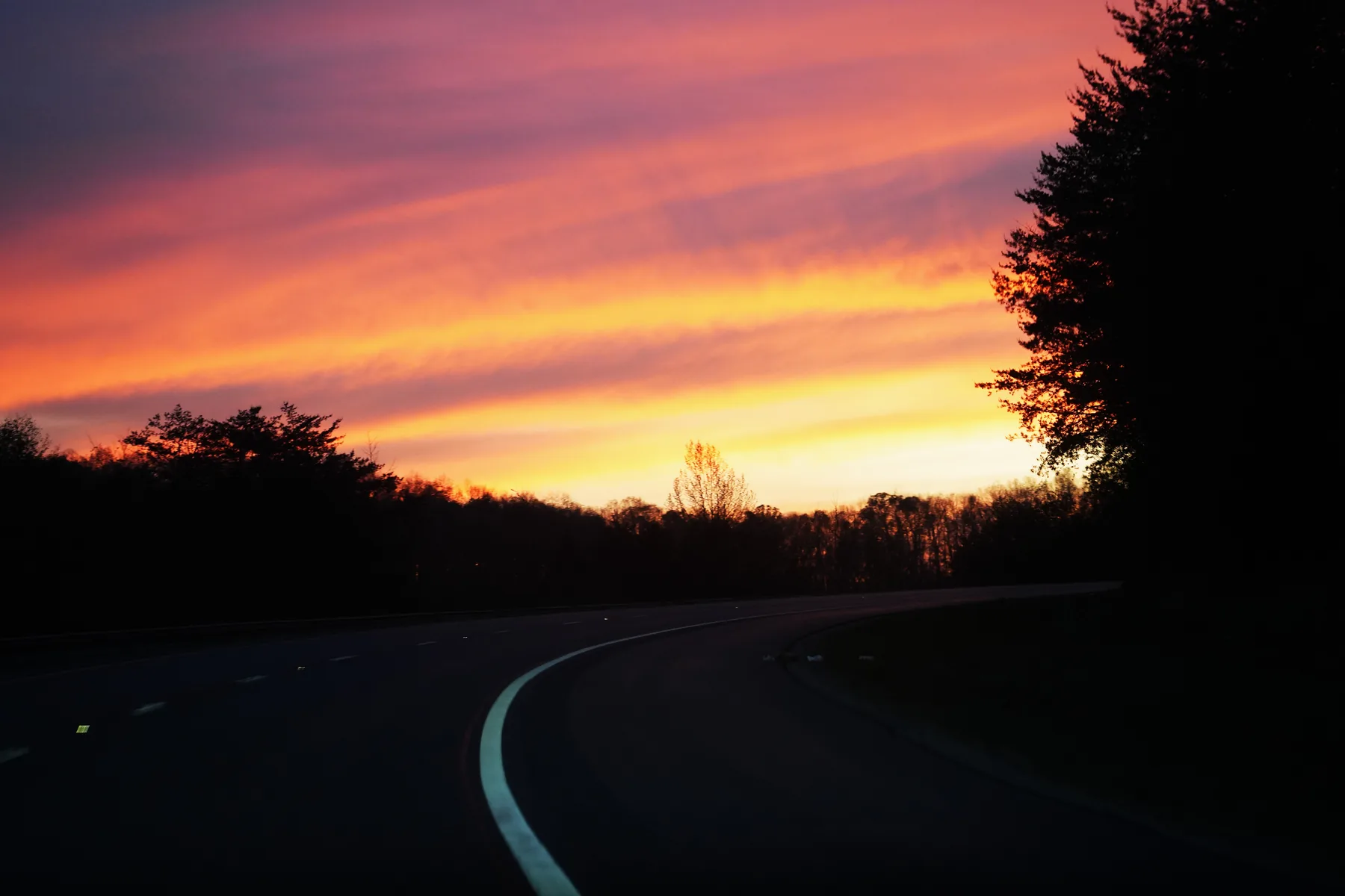 Mountain highway at sunset