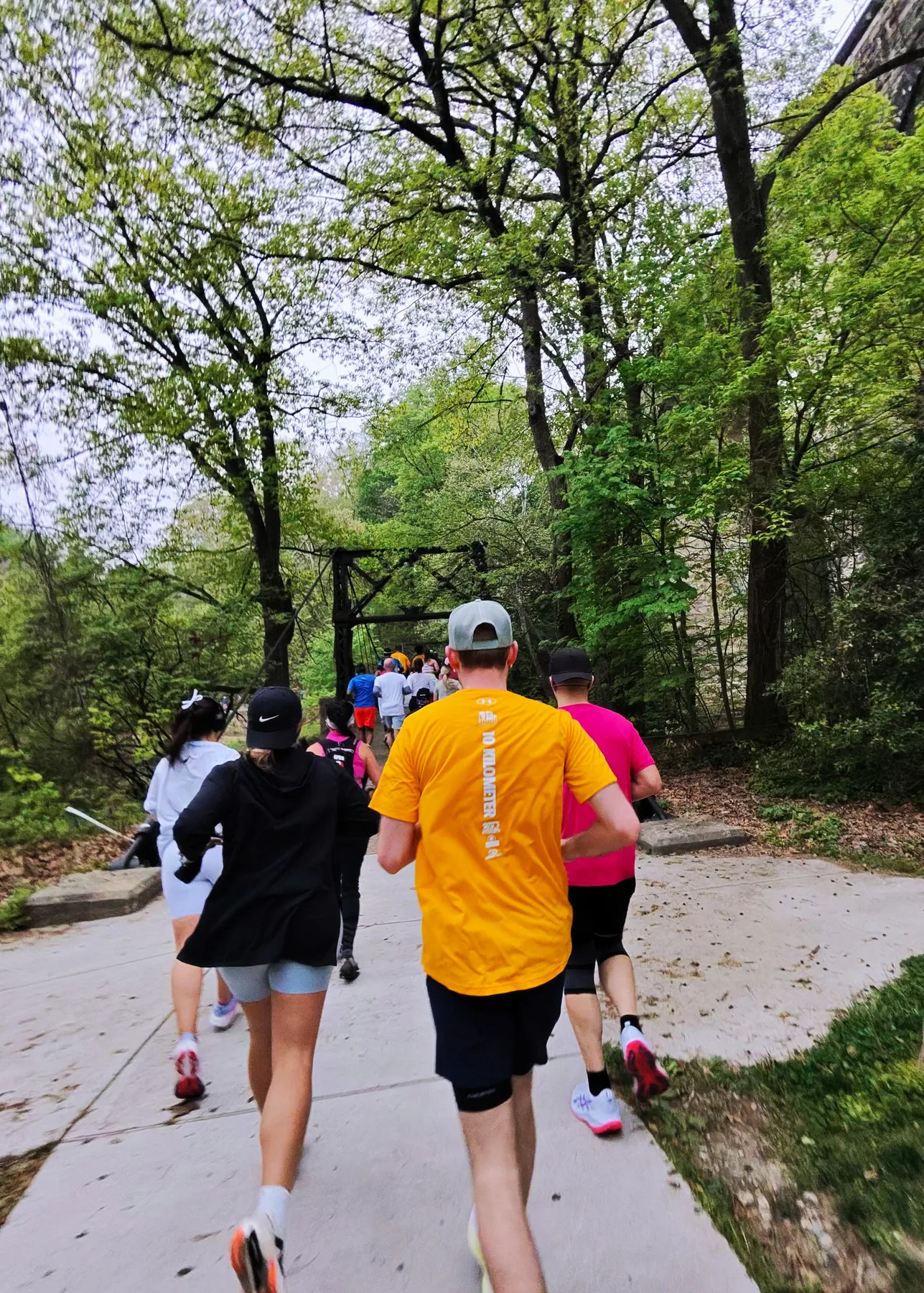 Runners on a wooded park trail