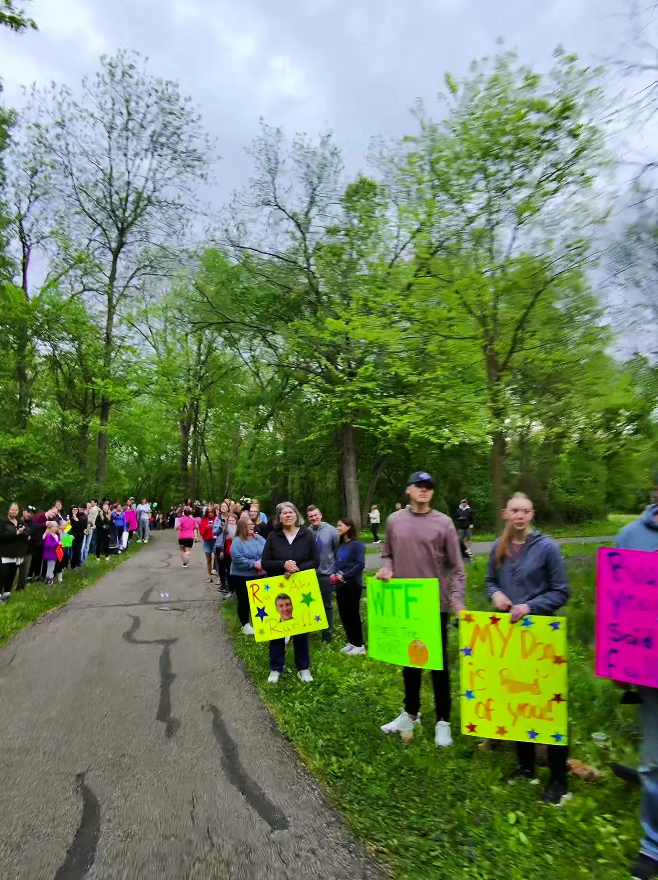 Volunteers cheering beside the race course